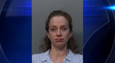 Woman arrested after alleged drunken outburst on SR-826; accused of kicking husband, blocking traffic and spitting on trooper