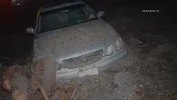 Mudslides trap drivers, bury roads and damage homes in Southern California